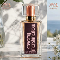 Thumbnail for Angle view showing fine fragrance mist spraying from Tru Fragrance Creamy Marshmallow bottle
