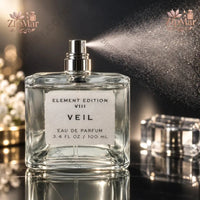 Thumbnail for Tru Fragrance Element Edition VIII Veil Eau de Parfum 3.4 oz clear glass bottle actively spraying with silver nozzle