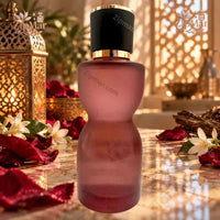 Thumbnail for Tru Fragrance Forbidden Petals Eau de Parfum frosted wine-red hourglass bottle with Moroccan lanterns and rose petals