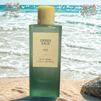 Thumbnail for Tru Fragrance Fresh Sage 003 Eau de Cologne bottle set against a sandy beach background