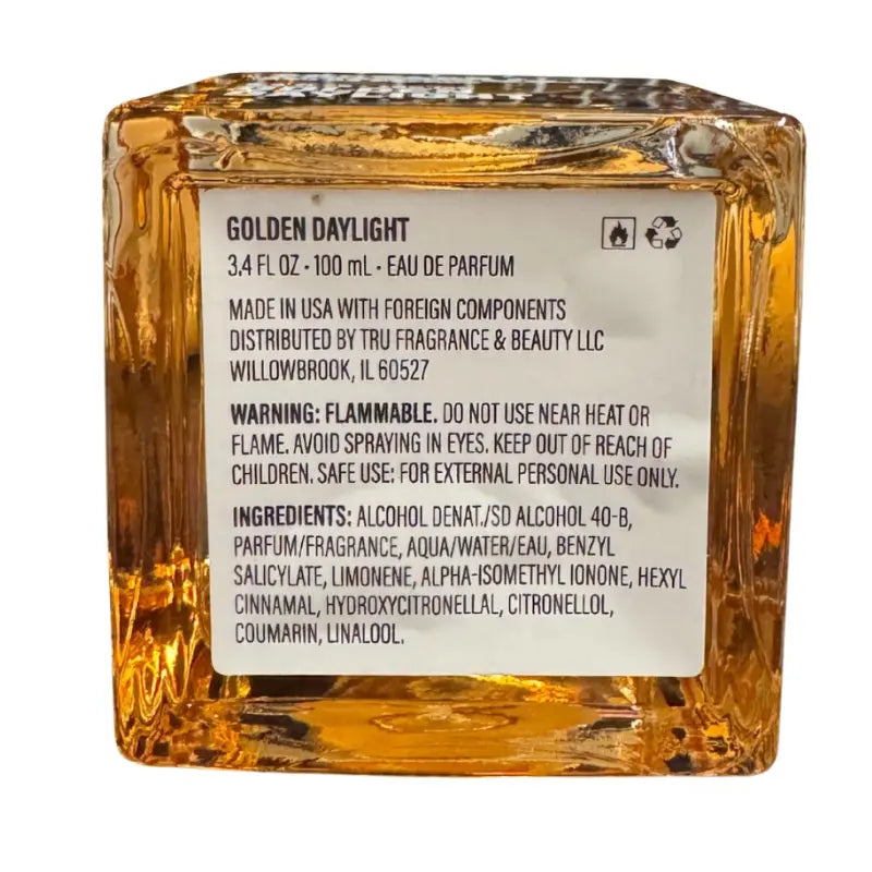 Close-up of the back label of Tru Fragrance Golden Daylight perfume showing ingredients, warning, and 100ml size.