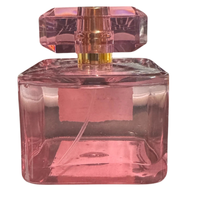 Thumbnail for Rear view of the rose-tinted glass bottle for Pearl Velvet Fig showing the fragrance liquid and spray tube.
