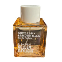 Thumbnail for Tru Fragrance Rhubarb + Almond Milk Golden Daylight Eau de Parfum 3.4 oz bottle front view with white cap.