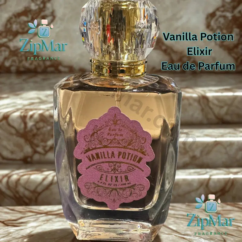 Close up of Vanilla Potion Elixir Eau de Parfum pink label with gold filigree and 3.4 fl oz 100 mL