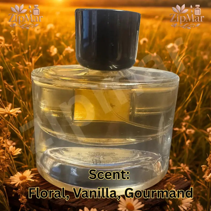 Back view of Vanilla Wildflower Eau de Parfum clear round glass bottle with golden liquid and dark cap