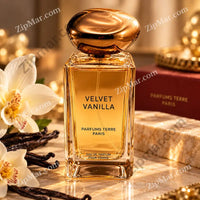 Thumbnail for Velvet Vanilla EDP by Parfums Terre Paris rectangular clear bottle with gold oval cap displayed on marble surface with white orchid blooms, vanilla beans, and burgundy gift box
