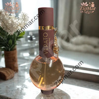 Thumbnail for Verato Pour Femme women’s fragrance in a round glass bottle with brown cap and gold charm on a marble bathroom counter