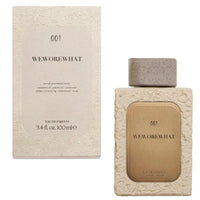 Thumbnail for WeWoreWhat 001 Eau de Parfum 3.4 fl oz bottle with gold label alongside matching textured retail box