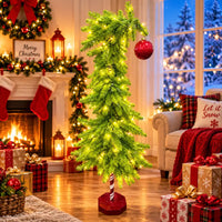 Thumbnail for 4.5 ft Whimsical Curved Pre-Lit Artificial Christmas Tree lit up next to fireplace