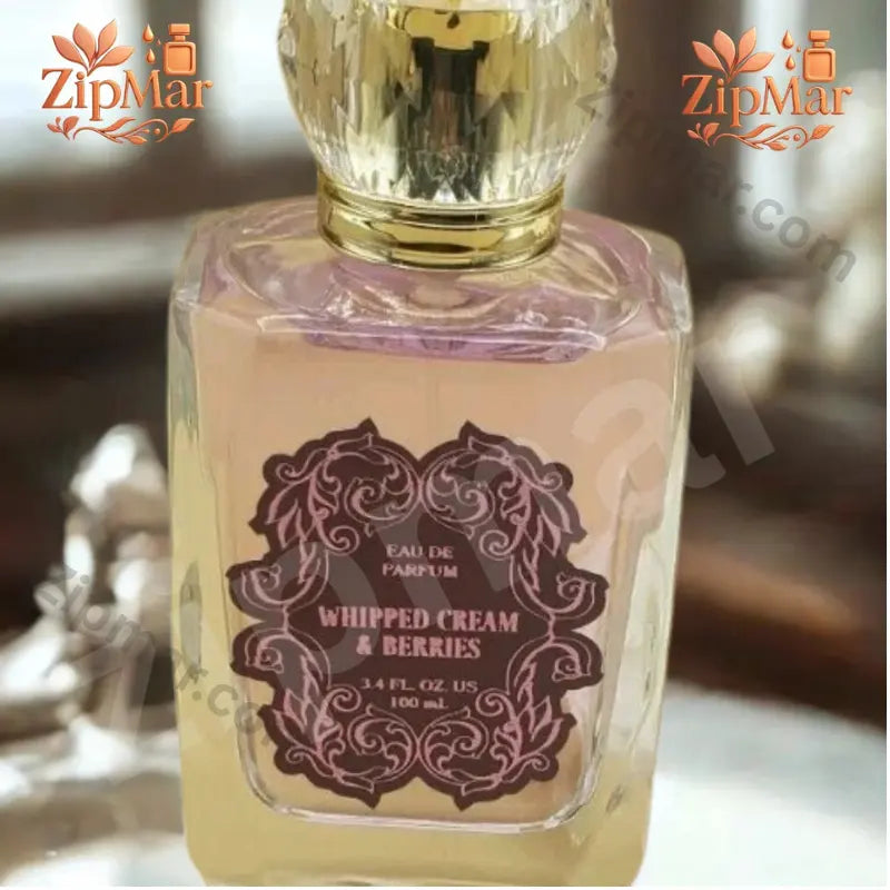 Close up of Whipped Cream and Berries Eau de Parfum burgundy label with pink filigree and 3.4 fl oz US 100 mL