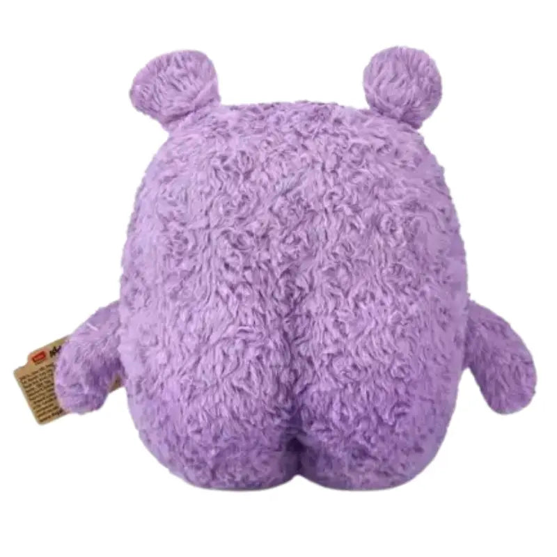 Rear view of purple textured plush monster showing rounded body and seam details