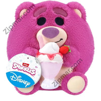Thumbnail for Pink Lotso Snackles plush by ZURU holding a strawberry sundae, with Disney hang tag